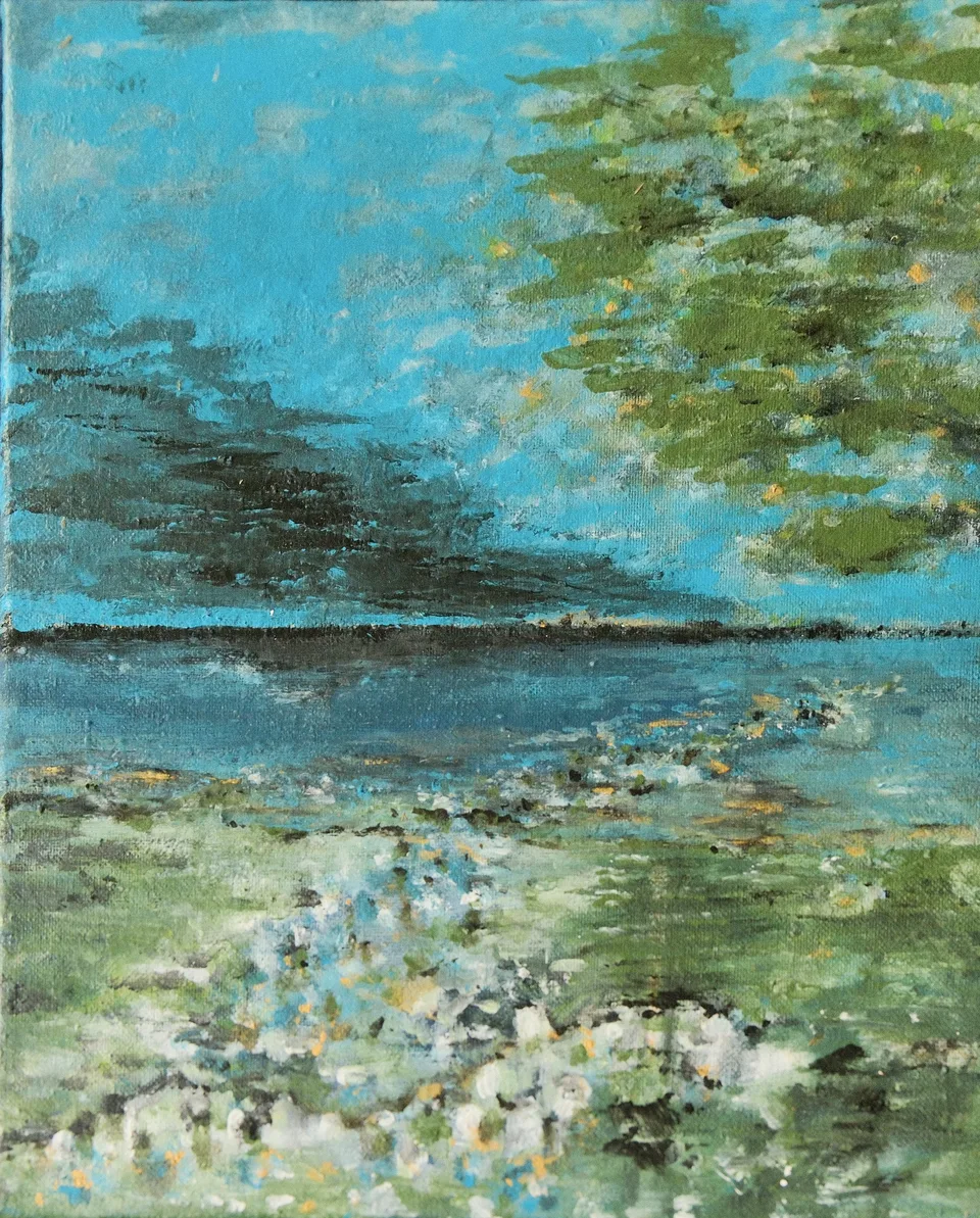 Vertical format: turquoise sky with dark streaks of cloud, the crown of a tree at the top right; below a dark shoreline a blue lake, and in the foreground a meadow with pale flowers.